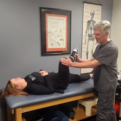 Chiropractor Ellicott City MD Brian Morrison With Patient Sciatica